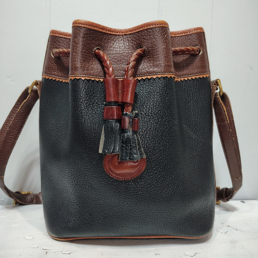 Dooney & Bourke Vintage Teton Black Leather Bucket Bag With Brown Trim Tassel